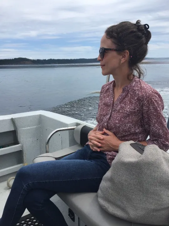 Amanda sitting on a boat, smiling